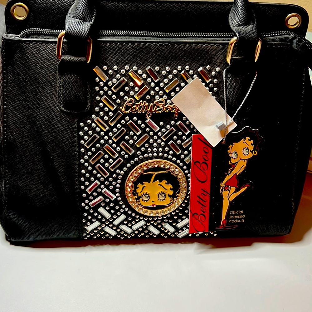Was collecting this Betty boop purse but now selling it